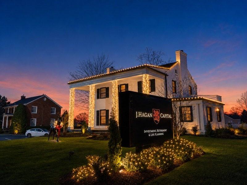 Historic building with holiday roofline lighting at dusk, Plant City FL